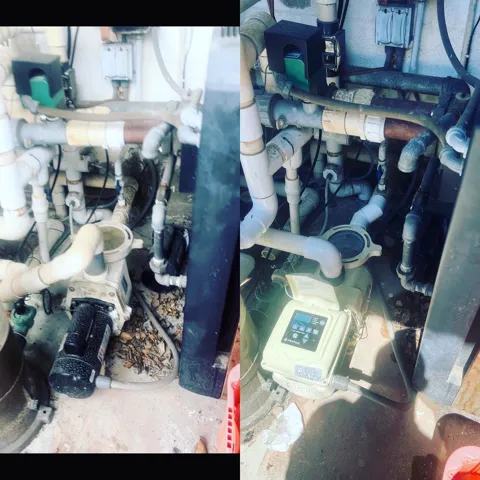 Old pool pump next to newly installed variable-speed pump