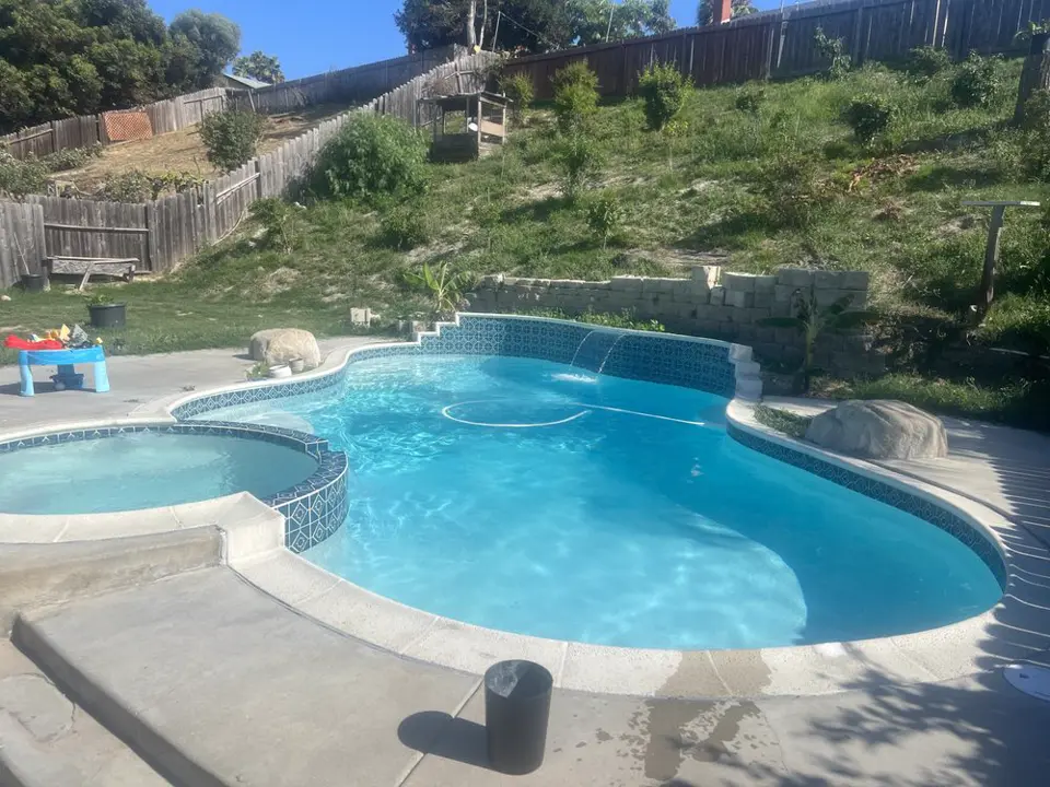 Sparkling clear pool and spa maintained by Algae Free Pool Service